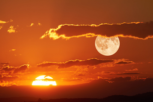 The sun and the moon can be seen simultaneously in the sky.